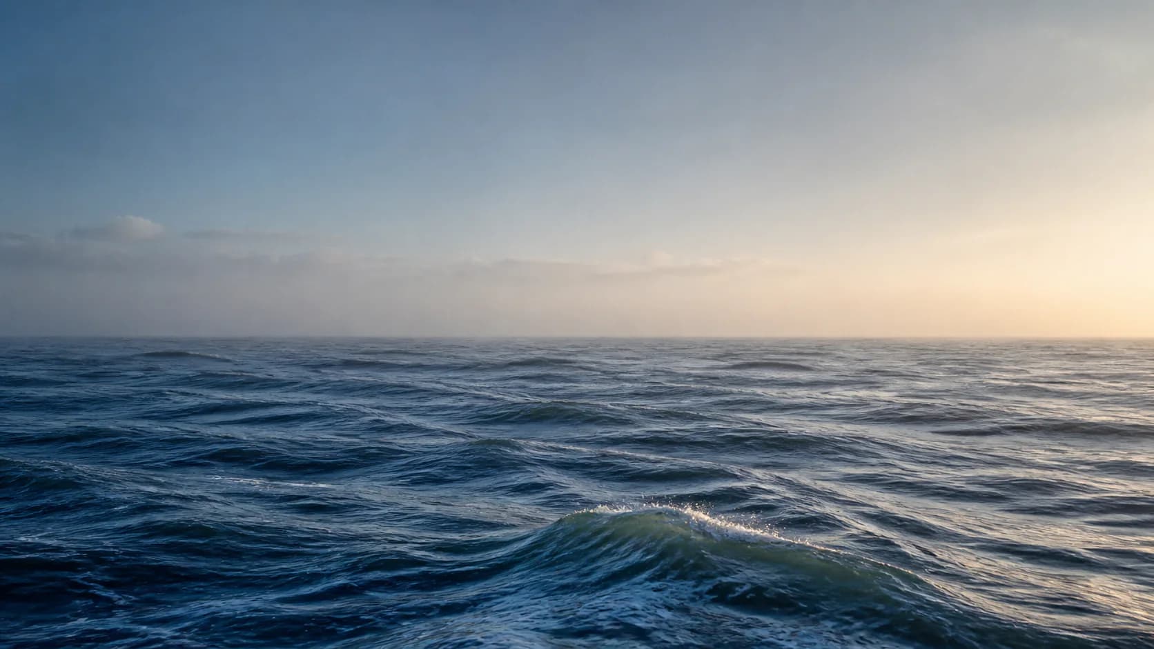 Rolling waves on the Arabian Sea at dawn