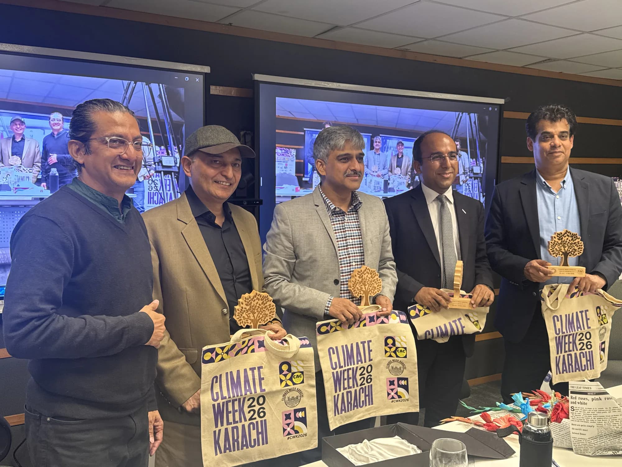 Climate Week Karachi speakers holding commemorative plaques